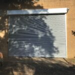 A property with a roller shutter door.